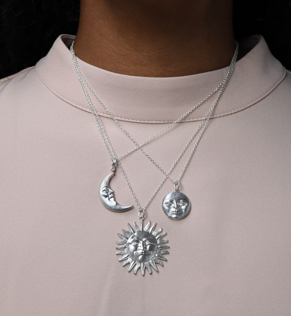 Anthony Lent Sterling Silver Crescent Moonface Necklace stacked with 2 other silver necklaces.
