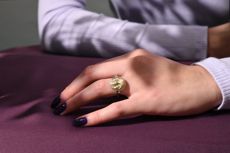 Anthony Lent Small Gold and Silver Moonface Ring on body.